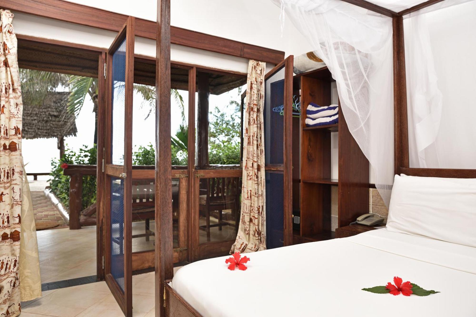 Mnarani Beach Cottages Нунгві Номер фото